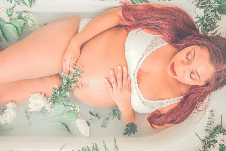 Pregnant woman milkbath photoshoot