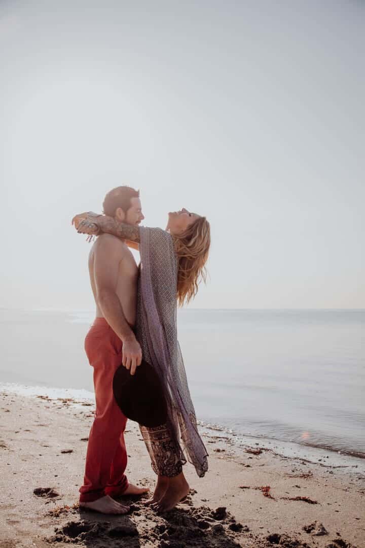 Aristic picture of couple hugging on the beach