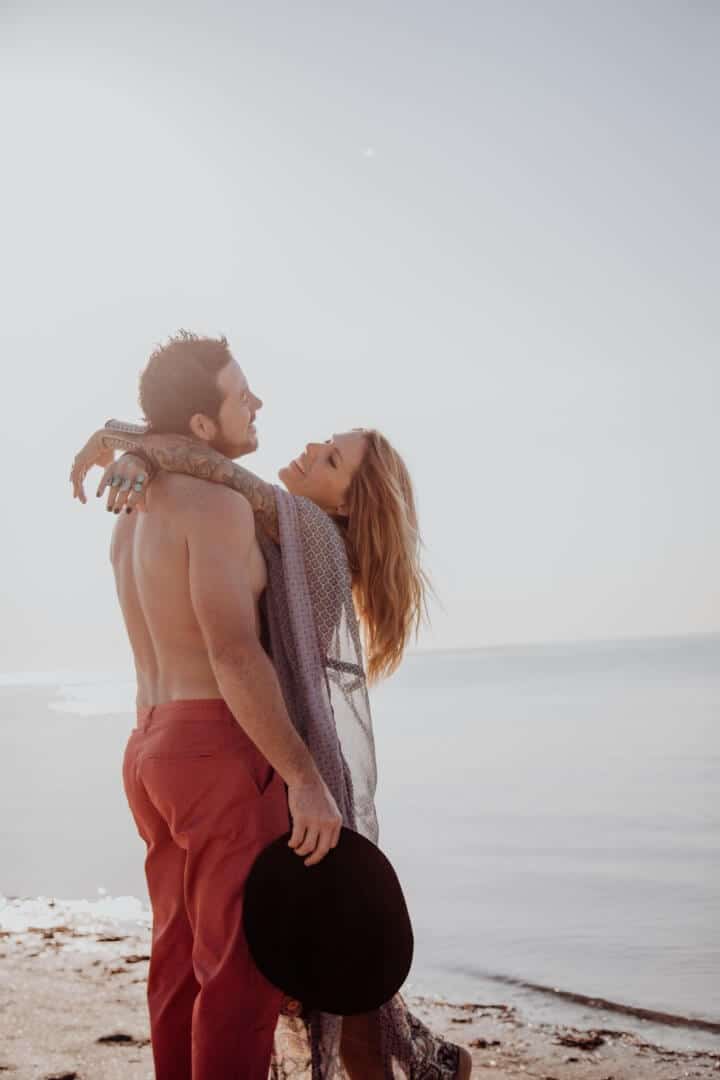 Aristic picture of couple hugging on the beach