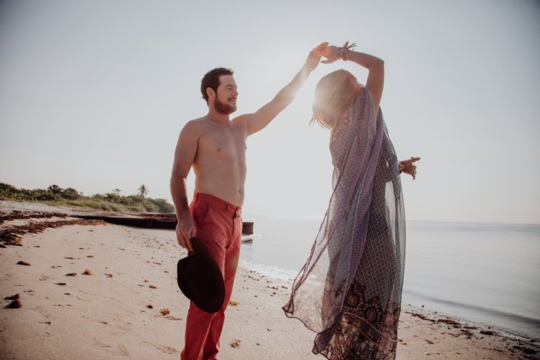 Aristic picture of couple having dancing on the beach